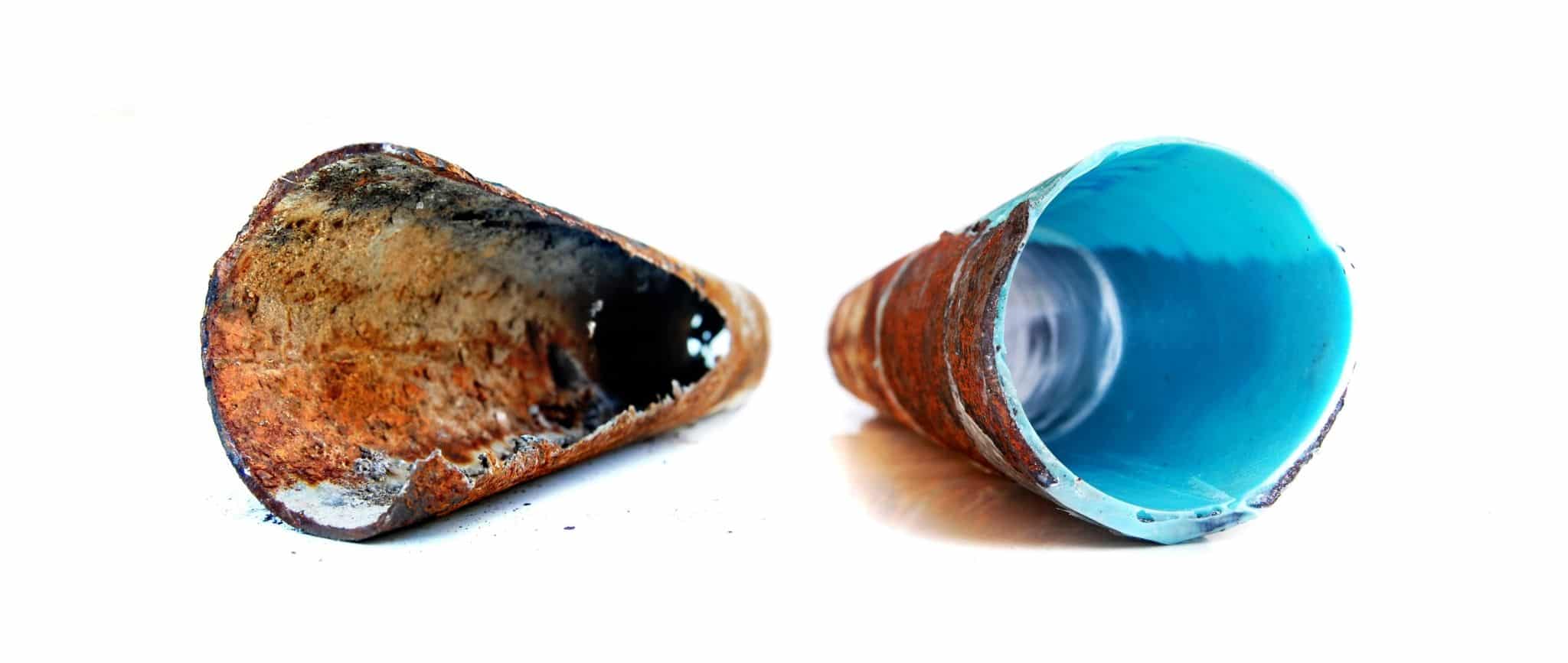 Before and after Nuflow pipe relining: a corroded, damaged pipe on the left, and a pipe restored with a blue epoxy liner on the right.